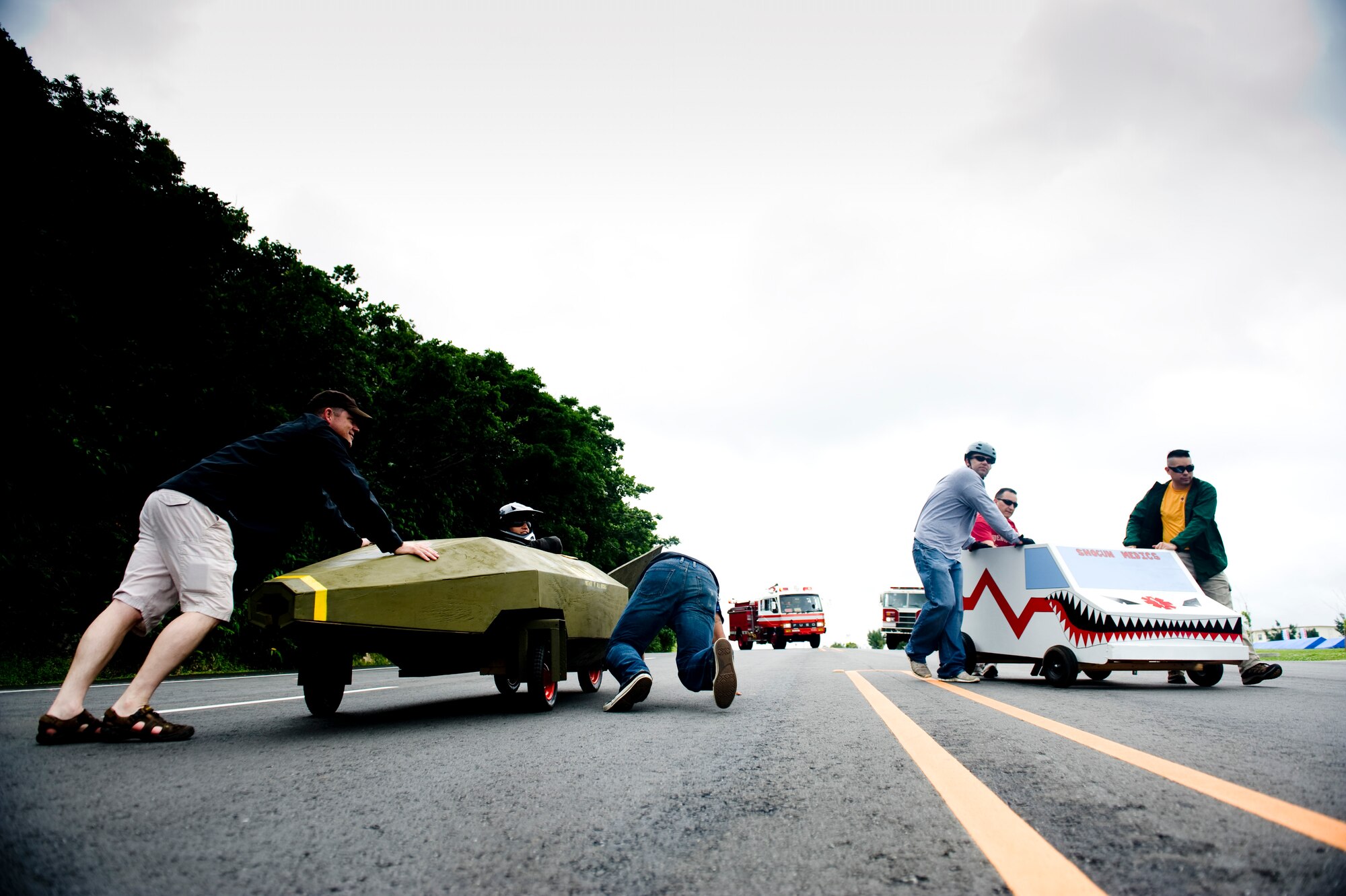 Teams from the 18th Munitions Squadron and 18th Medical Group line up to race during the Red Cross Derby Day at Kadena Air Base, Japan, April 24, 2012. The derby raised $5,200 for island-wide community service projects for U.S. service members and their families. (U.S. Air Force photo by Staff Sgt. Jonathan Steffen/Released)