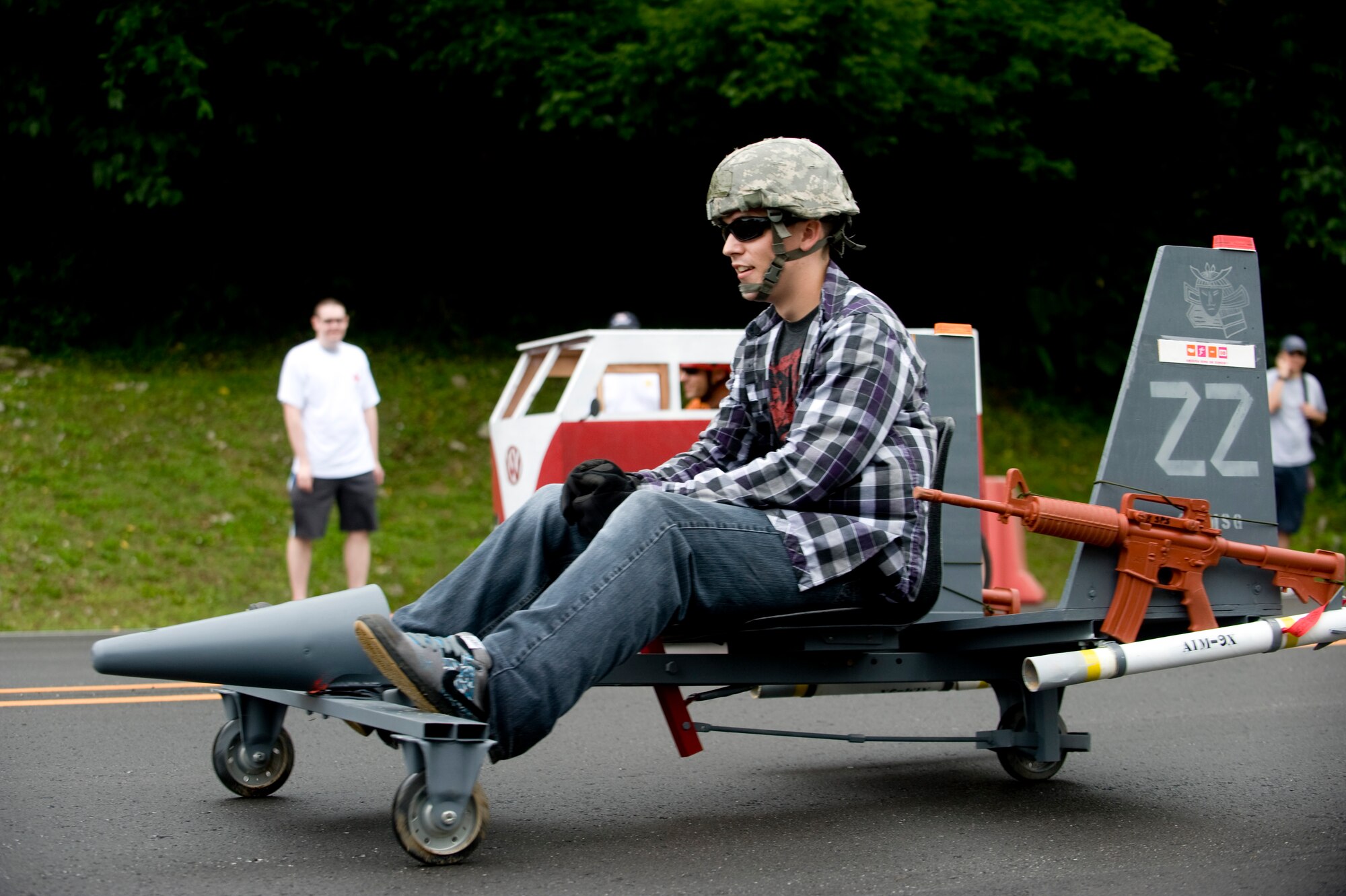 Airmen 1st Class Kyle Johnson, 18th Security Forces Squadron, flies down the hill at the Red Cross Derby Day at Kadena Air Base, Japan, April 24, 2012. The derby raised $5,200 for island-wide community service projects for U.S. service members and their families. (U.S. Air Force photo by Staff Sgt. Jonathan Steffen/ Released)