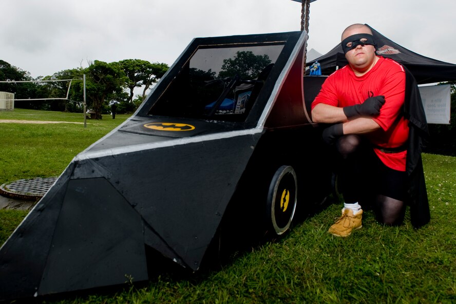 U.S. Army Sgt. David Tirri, 333rd Signal Company, stands next to his derby car at the Red Cross Derby Day at Kadena Air Base, Japan, April 24, 2012. Tirri and his car helped raise more than $400 for the derby. (U.S. Air Force photo by Staff Sgt. Jonathan Steffen/ Released)