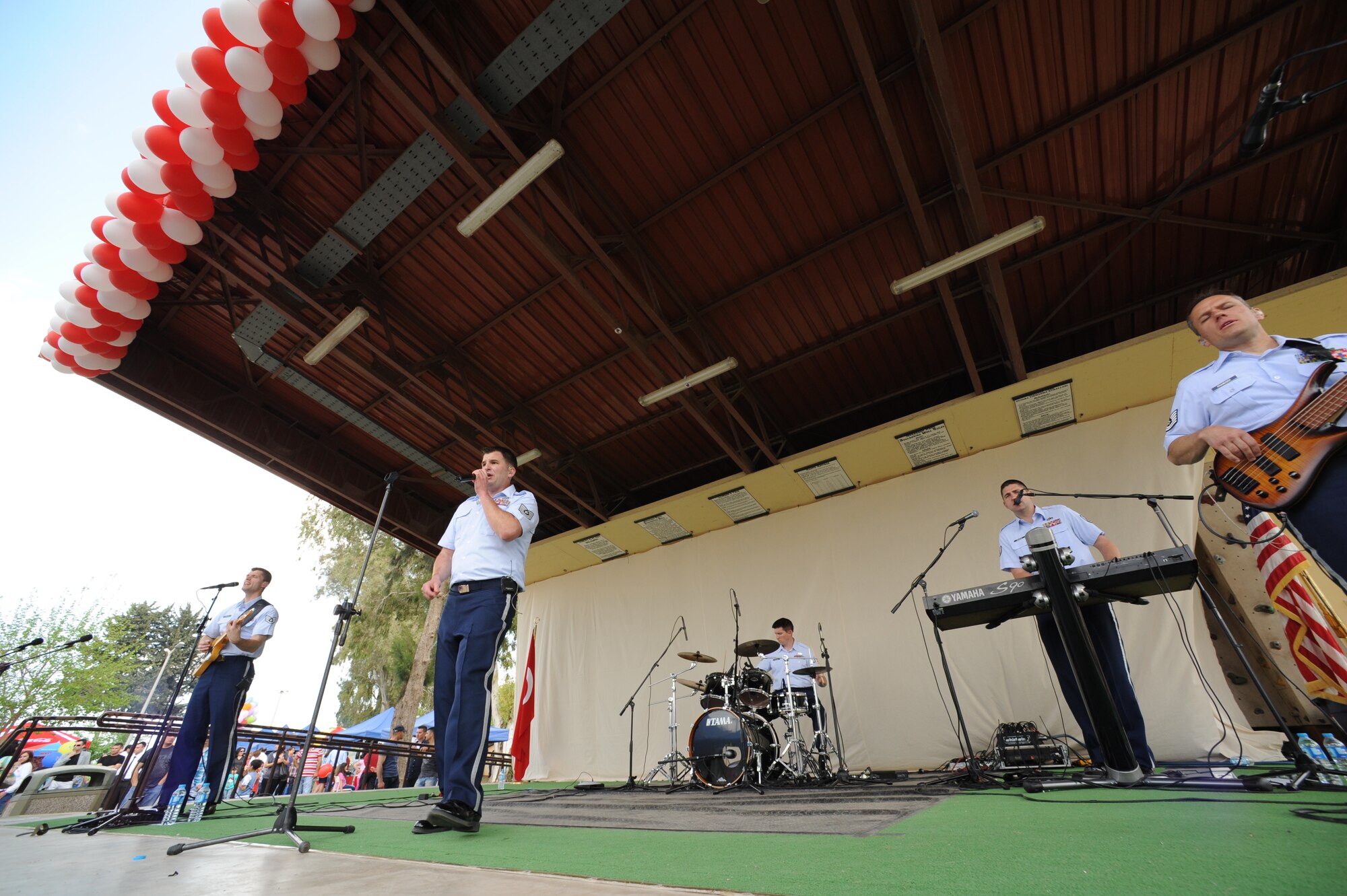 U.S. Air Forces in Europe rock band Touch 'n Go performs during a Children's Day festival April 22, 2012, at Incirlik Air Base, Turkey. The event was hosted by the Turkish air force 10th Tanker Base Command and was open to all Turkish and American members of Team Incirlik. The event offered an opportunity for camaraderie and building partnership between Turkish and American service members and civilians. Children's Day is a national holiday that honors Turkish children and the future of the country. (U.S. Air Force photo by Senior Airman Jarvie Z. Wallace/Released) 