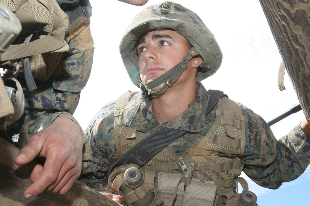 PFC Brandon Espinosa, Platoon 3255, Company L, 3rd Recruit Training Battalion, manuevers his way through the Weaver, an event at the Crucible, April 24 at Weapons and Field Training Battalion aboard Marine Corps Base Camp Pendleton, Calif. Espinosa joined the Marine Corps Reserves before he found out that his girlfriend was pregnant. With the responsibility and self-integrity instilled throughout recruit training, Espinosa hopes to apply these traits to being a good father for his child and toward his career.
