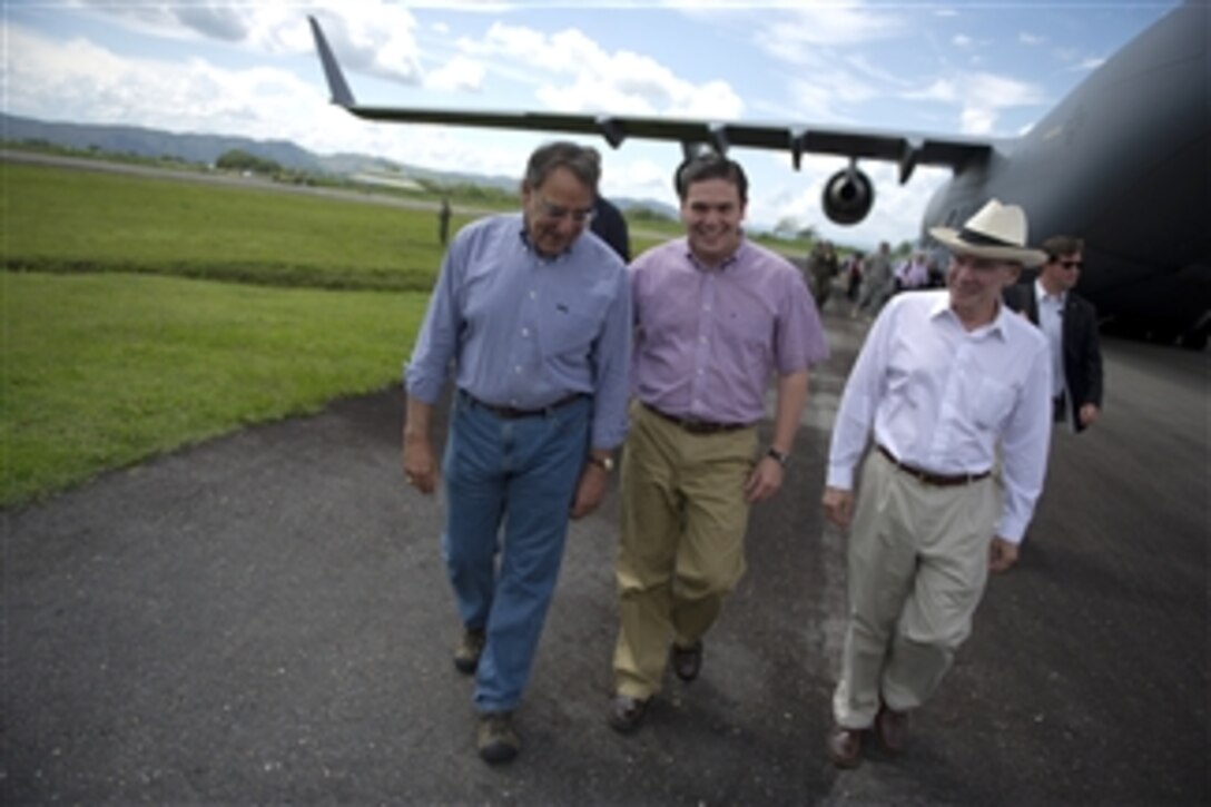 Secretary of Defense Leon E. Panetta, Colombian Minister of Defense Juan Carlos Pinzon Bueno, and U.S. Ambassador to Colombia Michael McKinley arrive in Tolemaida, Colombia, April 23, 2012, to observe Colombian special forces demonstrate their abilities and skills.  Panetta is on a five-day trip to the region to meet with counterparts and military officials in Brazil, Colombia and Chile to discuss an expansion of defense and security cooperation.  