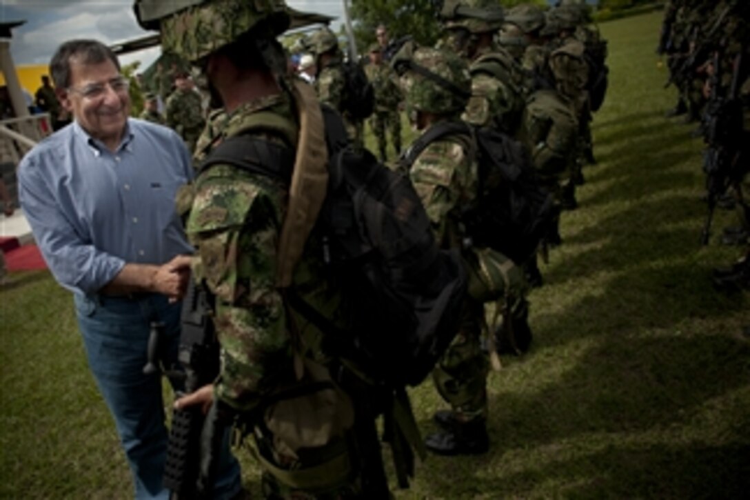 Secretary of Defense Leon E. Panetta greets Colombian Special Forces after a demonstration of their skills in Tolemaida, Colombia, April 23, 2012. Panetta is on a five-day trip to the region to meet with counterparts and military officials in Brazil, Colombia and Chile to discuss an expansion of defense and security cooperation.  
