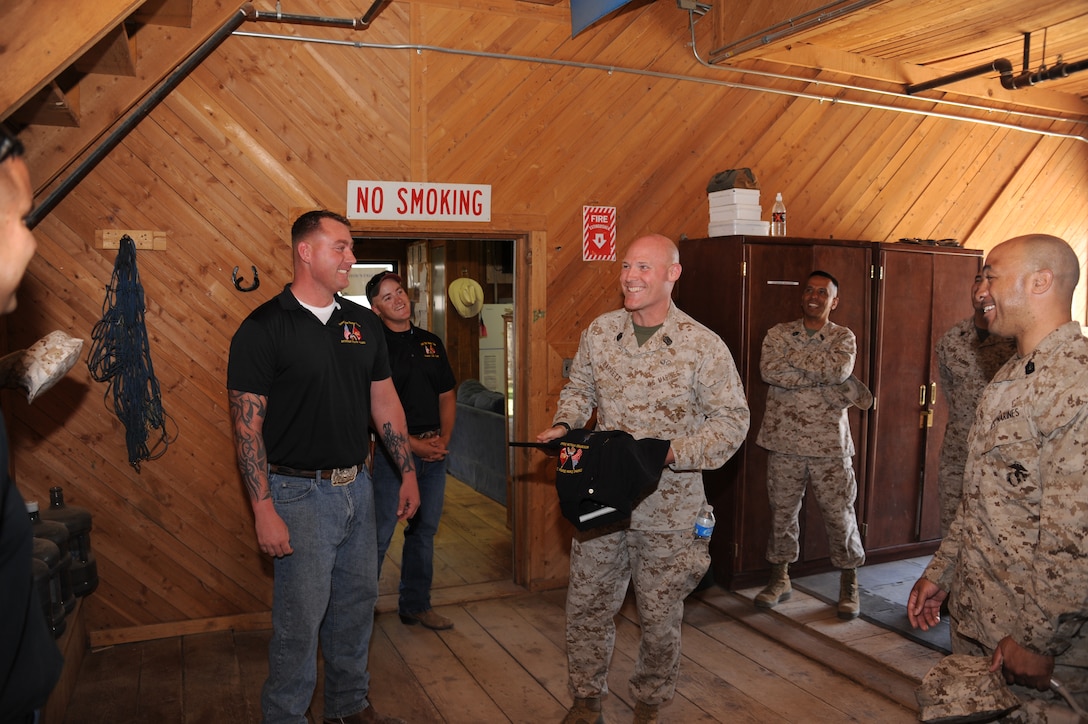 Sergeant Major Micheael P. Barrett shares a few laughs with Marines from the Mounted Color Guard during his visit to the base stables, April 24. This marked the first visit to MCLB Barstow for the 17th Sergeant Major of the Marine Corps.