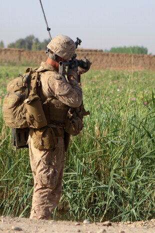 – Corporal Ryan Theis, a squad leader with Weapons Company, 2nd Battalion, 6th Marine Regiment, searches through his riflescope during a patrol April 24, 2012. Theis has led his Marines through numerous firefights while serving in Afghanistan. His sound decision making during combat has earned him the trust of his Marines.