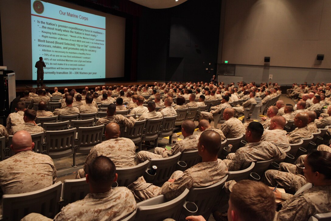 Marines of all ranks gather together to attend the Manpower Drawdown brief held at the Camp Pendleton's Bulldog Box Office April 24. Col. William Tosick explained how the breakdown and reduction of the Marine Corps will occur leading to fiscal year 2016. Tosick is the head of the Manpower Plans, Programs and Budget Branch for Headquarters Marine Corps.