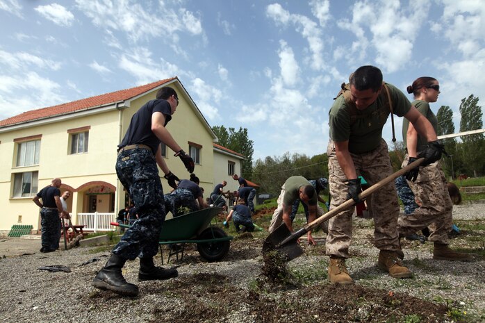 Marines and Sailors with the 24th Marine Expeditionary Unit and Iwo Jima Amphibious Ready Group renovate a playground at the Bethany Orphanage here, April 24, 2012, as part of a community relations project. Sixty Marines and Sailors from the USS Gunston Hall sacrificed time off during a port visit to help the orphanage. The 24th MEU and Iwo Jima ARG are currently deployed as a theater reserve and crisis response force capable of a variety of missions from full-scale combat operations to humanitarian assistance and disaster relief.