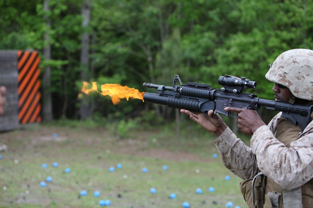 U.S. Marines from the ground combat element for Security Cooperation Task Africa Partnership Station 12, conduct a familiarization fire of various non-lethal munitions during non-lethal weapons training aboard Stone Bay, N.C., April 23, 2012. This training is part of APS-12's special operations capabilities certification in support of their upcoming deployment to Africa.::r::::n::::r::::n::::r::::n::