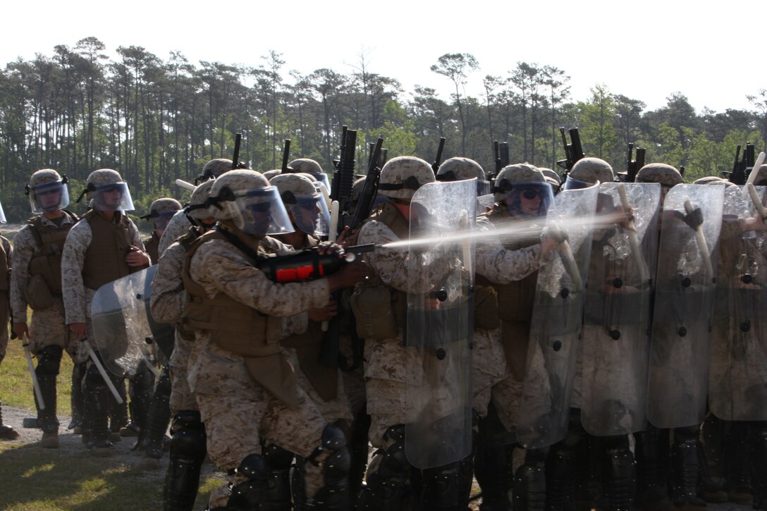 U.S. Marines from the ground combat element for Security Cooperation Task Africa Partnership Station 12 (APS-12), conduct scenario based riot control exercises against their fellow U.S. Marines aboard Stone Bay, N.C., April 26, 2012. This training is part of APS-12's special operations capabilities certification in support of their upcoming deployment to Africa.