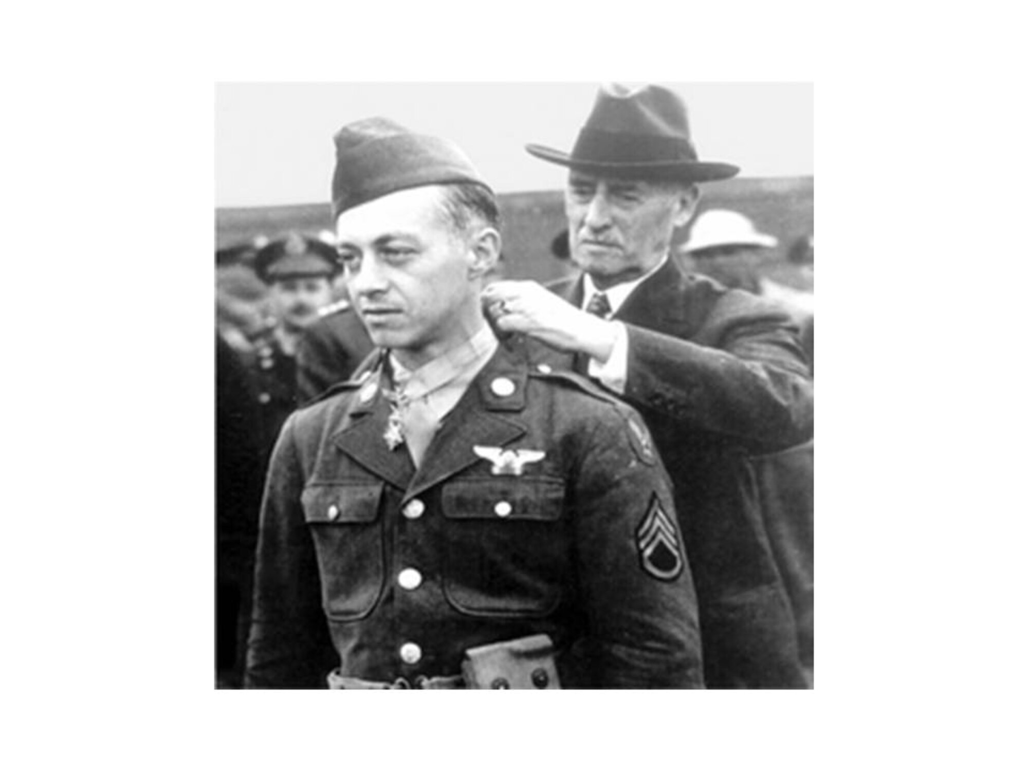 Staff Sergeant Maynard Harrison "Snuffy" Smith receives the Congressional Medal of Honor from Secretary of War Stimson. (Courtesy Photo)
