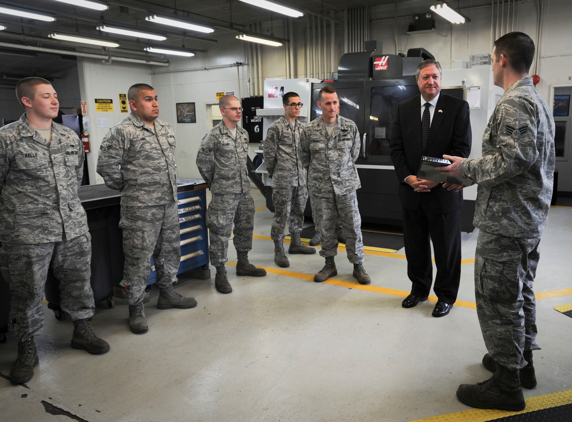 Secretary of the Air Force Michael Donley meets with Airmen from the 374th Maintenance Squadron machine metal fabrication shop at Yokota Air Base, Japan, April 24, 2012. (U.S. Air Force photo/Staff Sgt Stacy Moless)