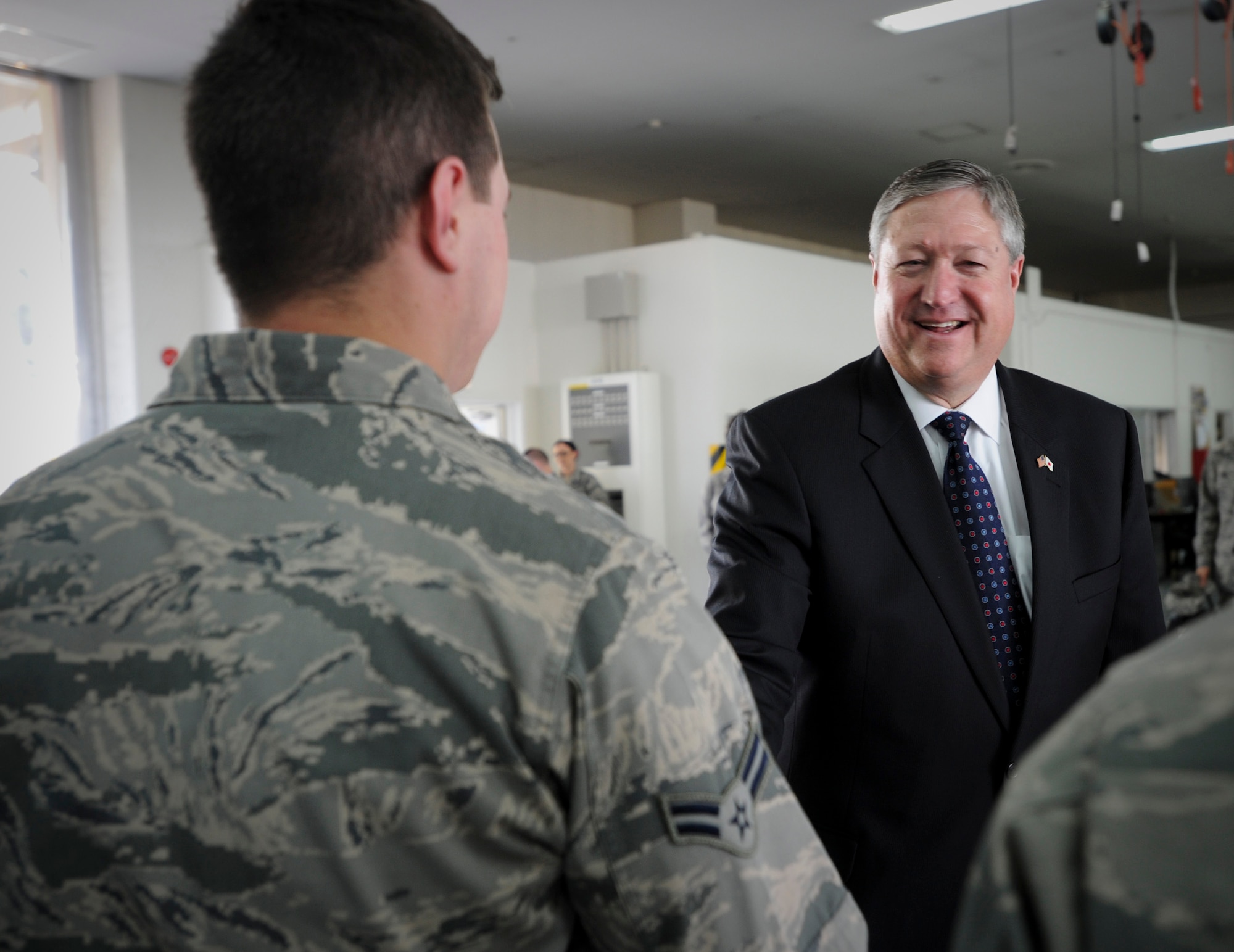 Secretary of the Air Force Michael Donley visits with Airmen at the Contingency Aeromedical Staging Facility at Yokota Air Base, Japan, April 24, 2012.  During his visit to the base, the secretary toured various facilities throughout the 374th Airlift Wing, 5th Air Force, U.S. Forces, Japan and the Japan Air Self-Defense Force Air Defense Command Headquarters. (U.S. Air Force photo/Staff Sgt Stacy Moless)