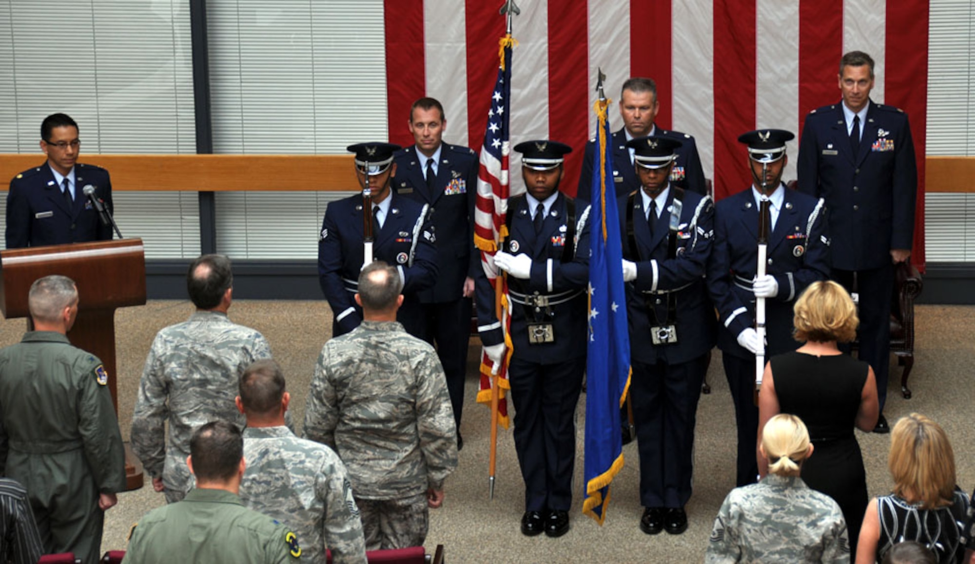 TRAVIS AIR FORCE BASE, Calif. -- Col. Matthew J. Burger, 349th Operations Group commander (left), passes the flag of the 349th Air Mobility Operations Squadron to Lt. Col. Paul Hromanik, in a change of command ceremony here April 22. The ceremony was well attended by members of Team Travis. The change of command ceremony is a time-honored tradition which formally symbolizes the continuity of authority as the command is passed from one officer to another. (U.S. Air Force photo / Capt. Robin Jackson)
