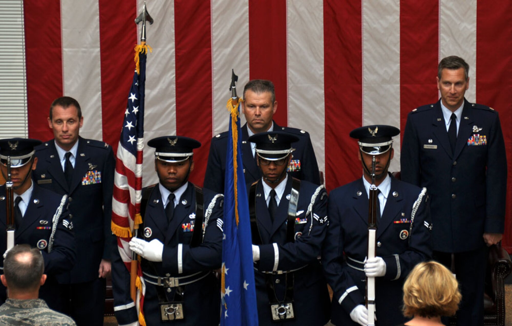 TRAVIS AIR FORCE BASE, Calif. -- Col. Matthew J. Burger, 349th Operations Group commander (left), passes the flag of the 349th Air Mobility Operations Squadron to Lt. Col. Paul Hromanik, in a change of command ceremony here April 22. The ceremony was well attended by members of Team Travis. The change of command ceremony is a time-honored tradition which formally symbolizes the continuity of authority as the command is passed from one officer to another. (U.S. Air Force photo / Capt. Robin Jackson)