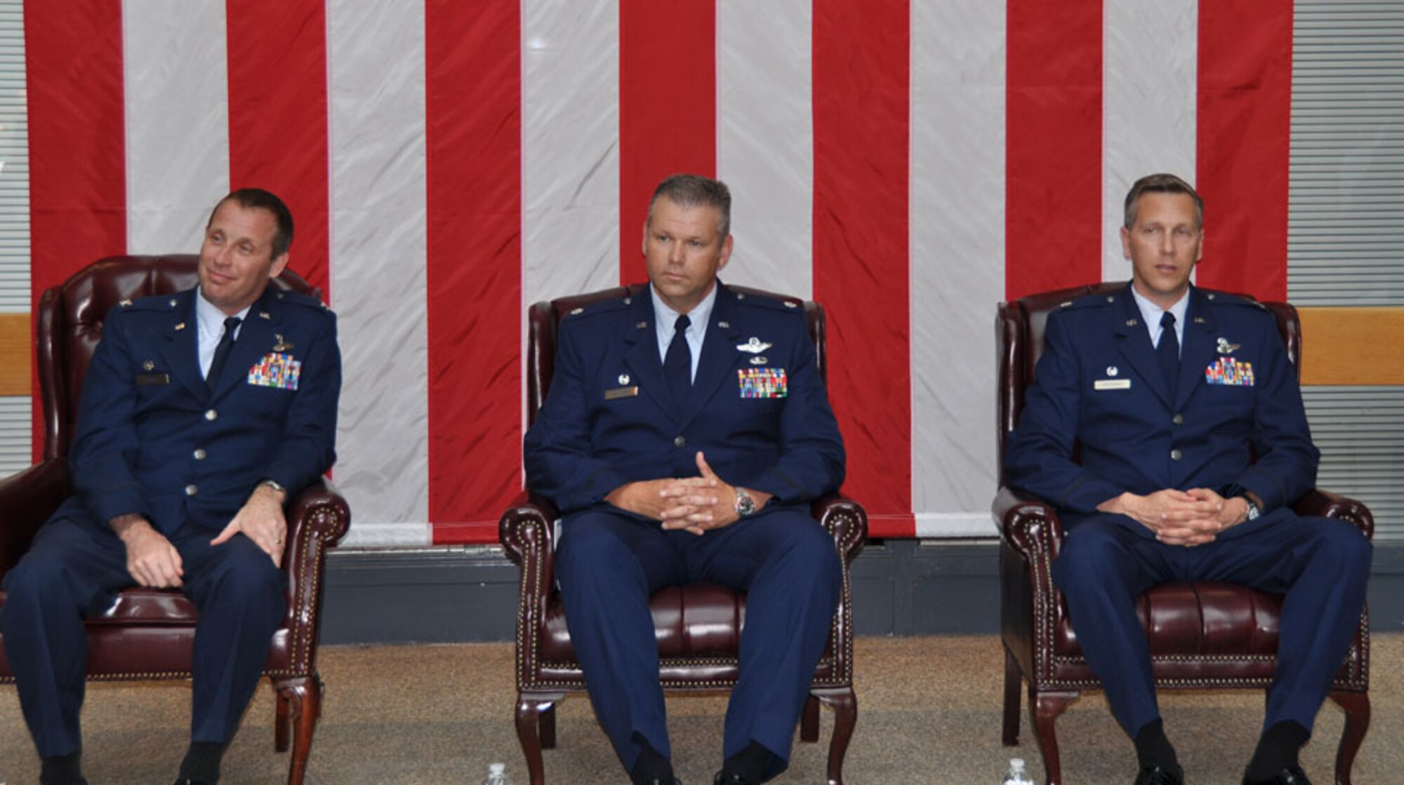 TRAVIS AIR FORCE BASE, Calif. -- Col. Matthew J. Burger, 349th Operations Group commander (left), passes the flag of the 349th Air Mobility Operations Squadron to Lt. Col. Paul Hromanik, in a change of command ceremony here April 22. The ceremony was well attended by members of Team Travis. The change of command ceremony is a time-honored tradition which formally symbolizes the continuity of authority as the command is passed from one officer to another. (U.S. Air Force photo / Capt. Robin Jackson)