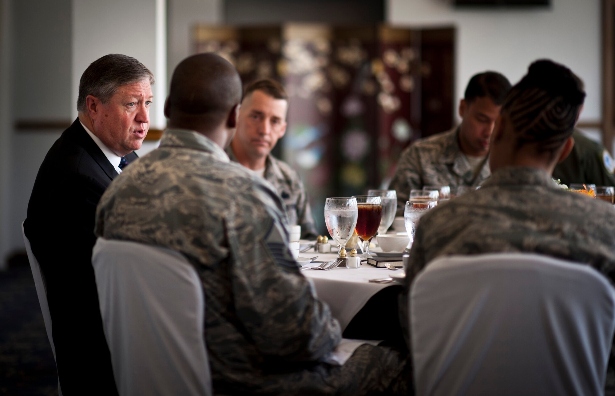 Secretary of the Air Force Michael Donley (left) talks with Airmen from the 374th Airlift Wing, 5th Air Force and U.S. Forces, Japan, during a luncheon at Yokota Air Base, Japan, April 24, 2012. Donley visited Yokota during a trip through the western Pacific region to meet with Airmen and thank them for their service. (U.S. Air Force photo/Staff Sgt. Samuel Morse)