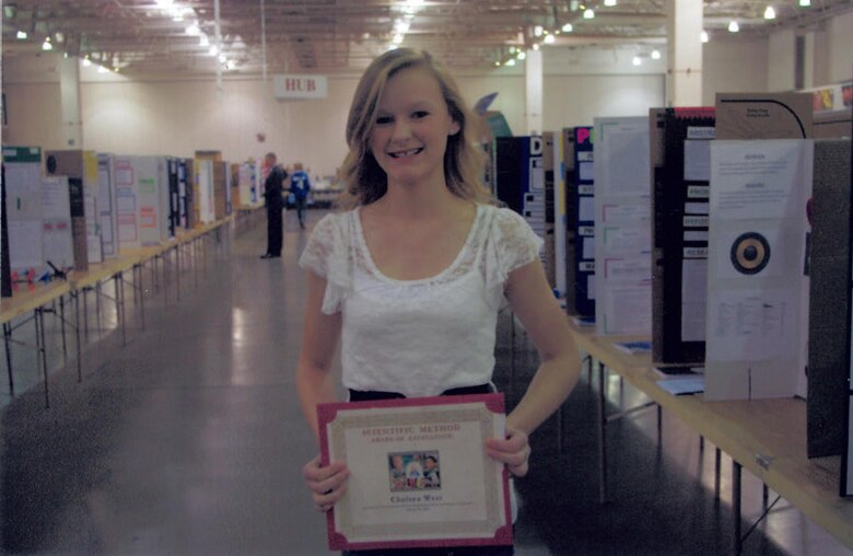 Chelsea West, eigth grader at D-M's Sonoran Science Academy, poses for a picture after winning the International Science and Engineering Academy observer award. (Courtesy photo)