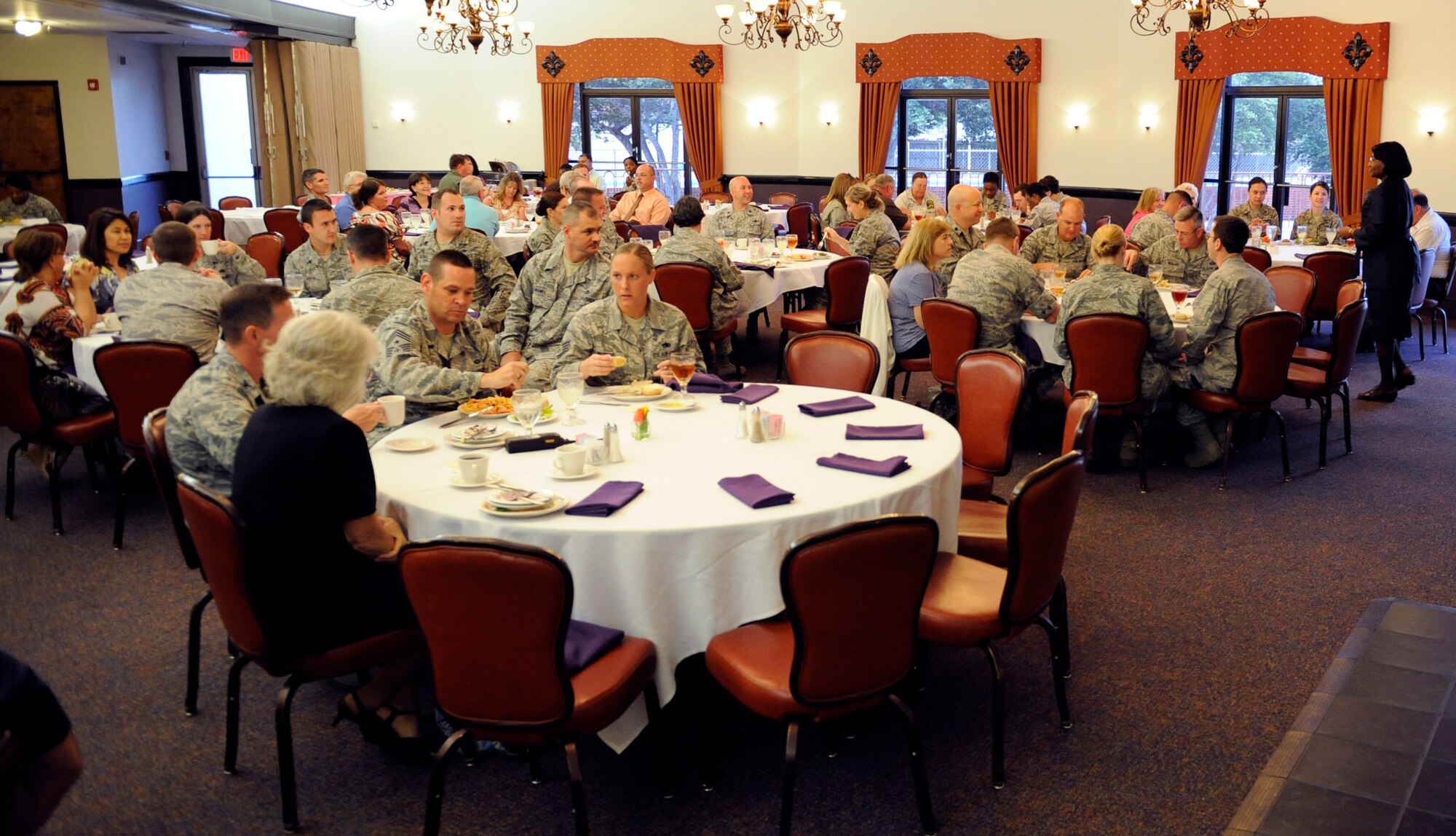 Members of the 2nd Bomb Wing eat lunch at the Barksdale Club in celebration of Administrative Professionals' Day on Barksdale Air Force Base, La., April 25. Administrative Professionals' Day, or Secretaries' Day, is celebrated annually on Wednesday of the last full week in April. This unofficial holiday recognizes all secretaries, receptionists and administrative support professionals. (U.S. Air Force photo/Airman 1st Class Benjamin Gonsier)(RELEASED)
