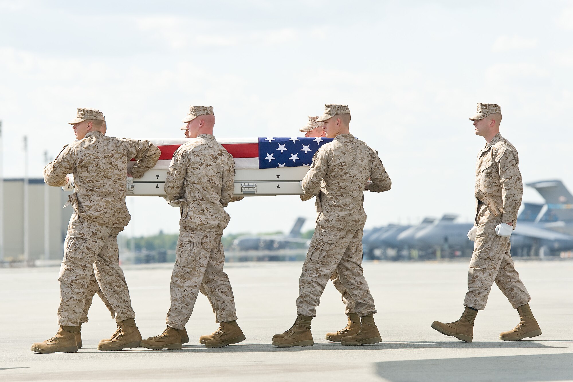 A U.S. Marine Corps carry team transfers the remains of Marine Staff Sgt. Joseph H. Fankhauser, of Mason, Texas, at Dover Air Force Base, Del., April 25, 2012. Fankhauser was assigned to 7th Engineer Support Battalion, 1st Marine Logistics Group, I Marine Expeditionary Force, Camp Pendleton, Calif. (U.S. Air Force photo/Roland Balik)