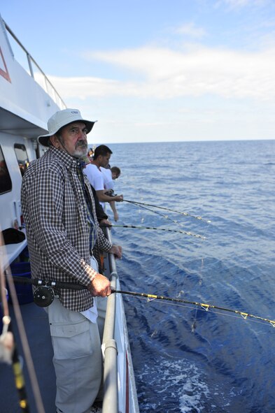 Fishermen hang their poles over the side of the boat as they wait for the ship’s captain to give the order to drop their lines in the water of the Atlantic Ocean April 14, 2012. Shaw’s outdoor recreation offers several deep sea fishing trips throughout the spring and summer that Department of Defense ID card holders can take advantage of. (U.S. Air Force photo by Senior Airman Daniel Phelps/Released)