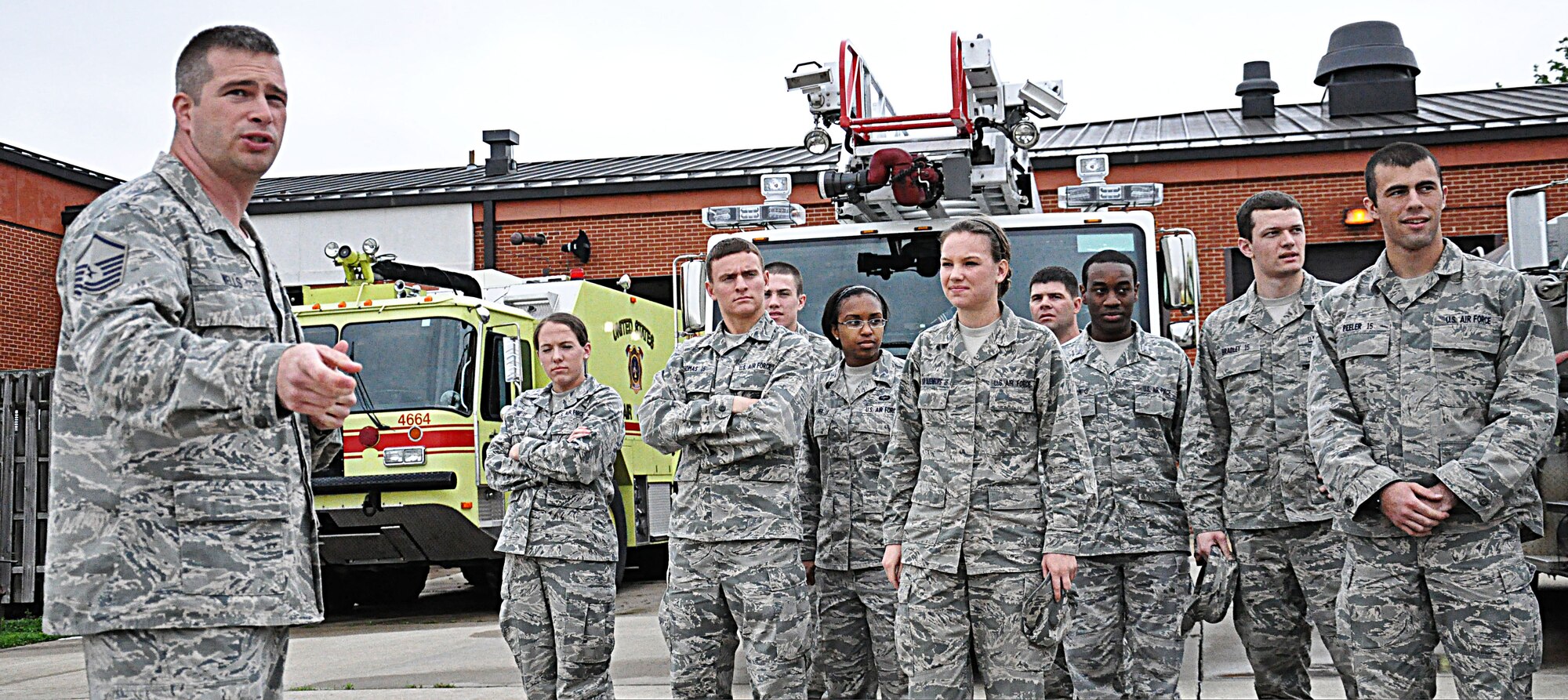 Master Sgt. Brian Wells, 375th Civil Engineer Squadron fire department station chief, explains the capabilities of the vehicles they use to the cadets of Cadet Squadron 24 at Scott Air Force Base, Ill. Each cadet squadron has a wing to sponsor a base visit. Scott was the sponsor for Cadet Squadron 24. (U.S. Air Force photo/Airman 1st Class Jake Eckhardt)