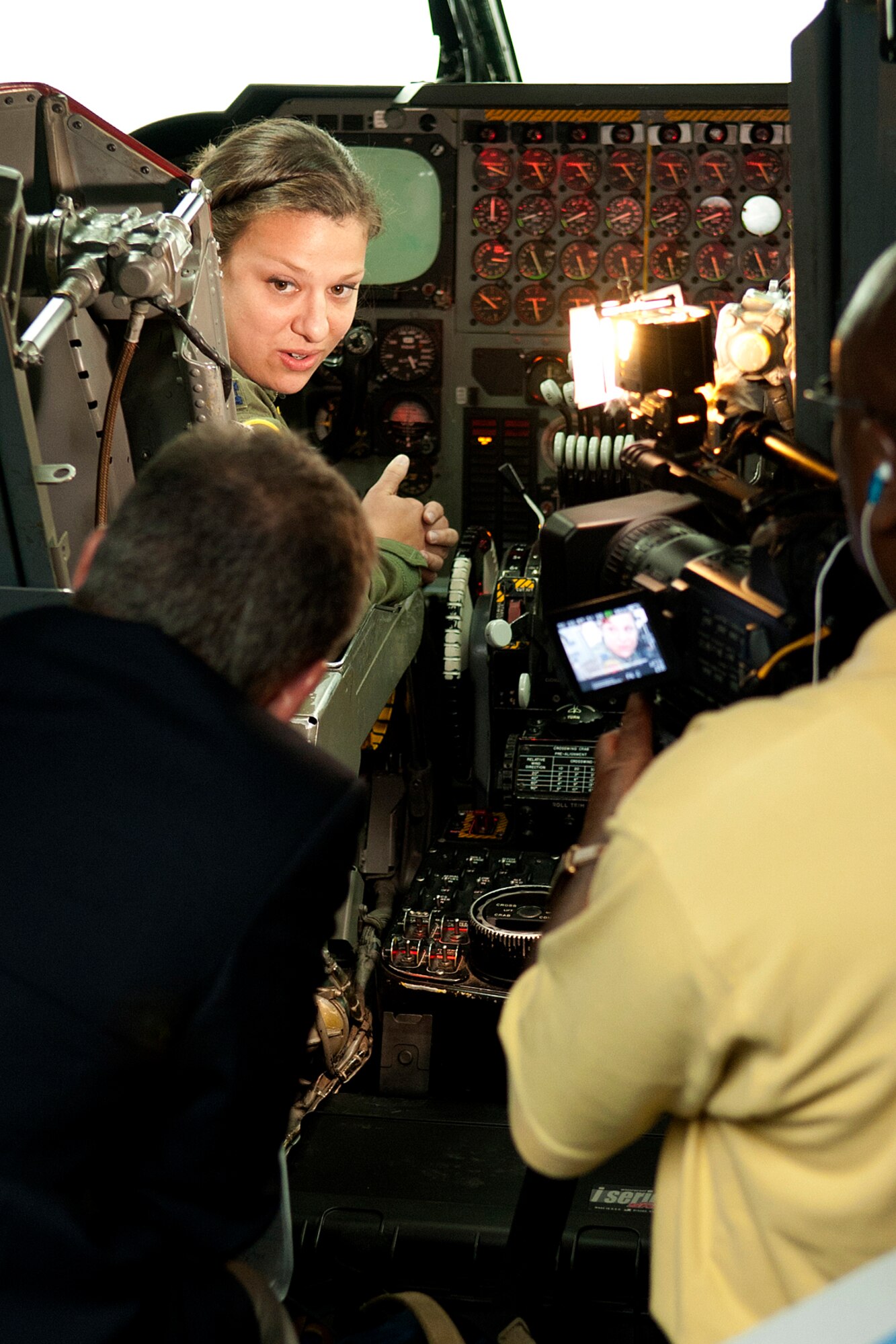 U.S. Air Force Capt. El Len Serra, 11th Bomb Squadron pilot, is interviewed by Patrick Simon, KSLA News 12 anchor and reporter, in a B-52 cockpit simulator at Barksdale Air Force Base, La., April 25, 2012. Simon interviewed personnel from the 93rd and 11th Bomb Squadrons for a news segment on the B-52 Formal Training Unit at Barksdale. (U.S. Air Force photo by Master Sgt. Greg Steele/Released)