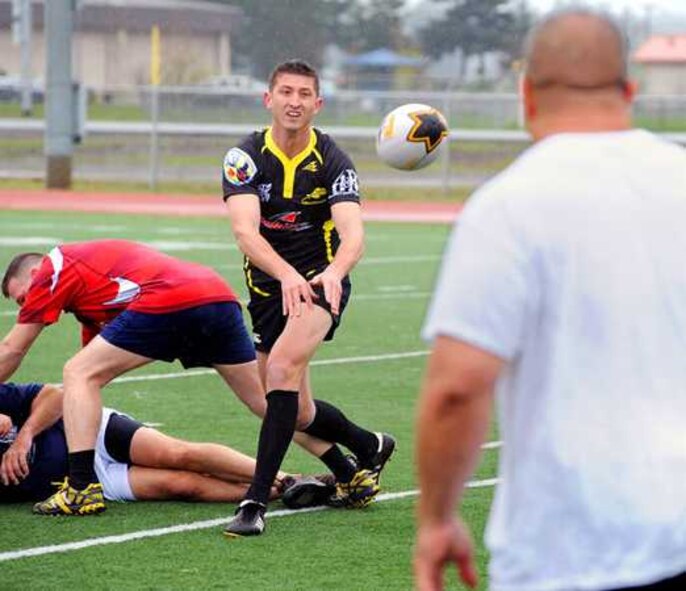 Capt. Aaron Scogin, center, 62nd Operations Support Squadron, will represent the Air Force in the 2012 Armed Forces Rugby Championship in November, a tournament that the Air Force has won eight years in a row. “I’d love to be part of a team that wins an Armed Forces Championship, and we’ll see where it goes from there,” Scogin said. (U.S. Air Force courtesy photo/Scott Hansen)