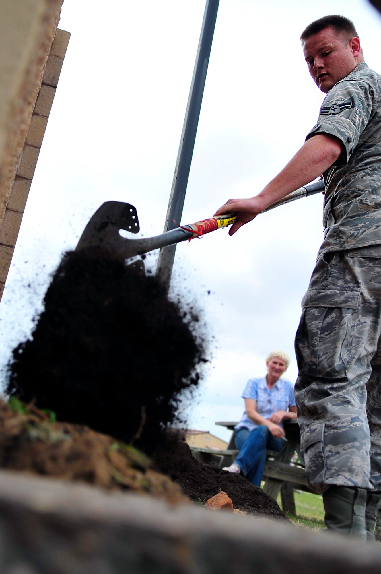 Airman 1st Class Nathan Andrews, 28th Operational Weather Squadron forecaster, shovels mulch into a garden as part of his squadron’s observance of Earth Day at Shaw Air Force Base, S.C., April 20, 2012. The produce from their garden will later be used in a fall festival. (U.S. Air Force photo by Senior Airman Daniel Phelps/ Released)