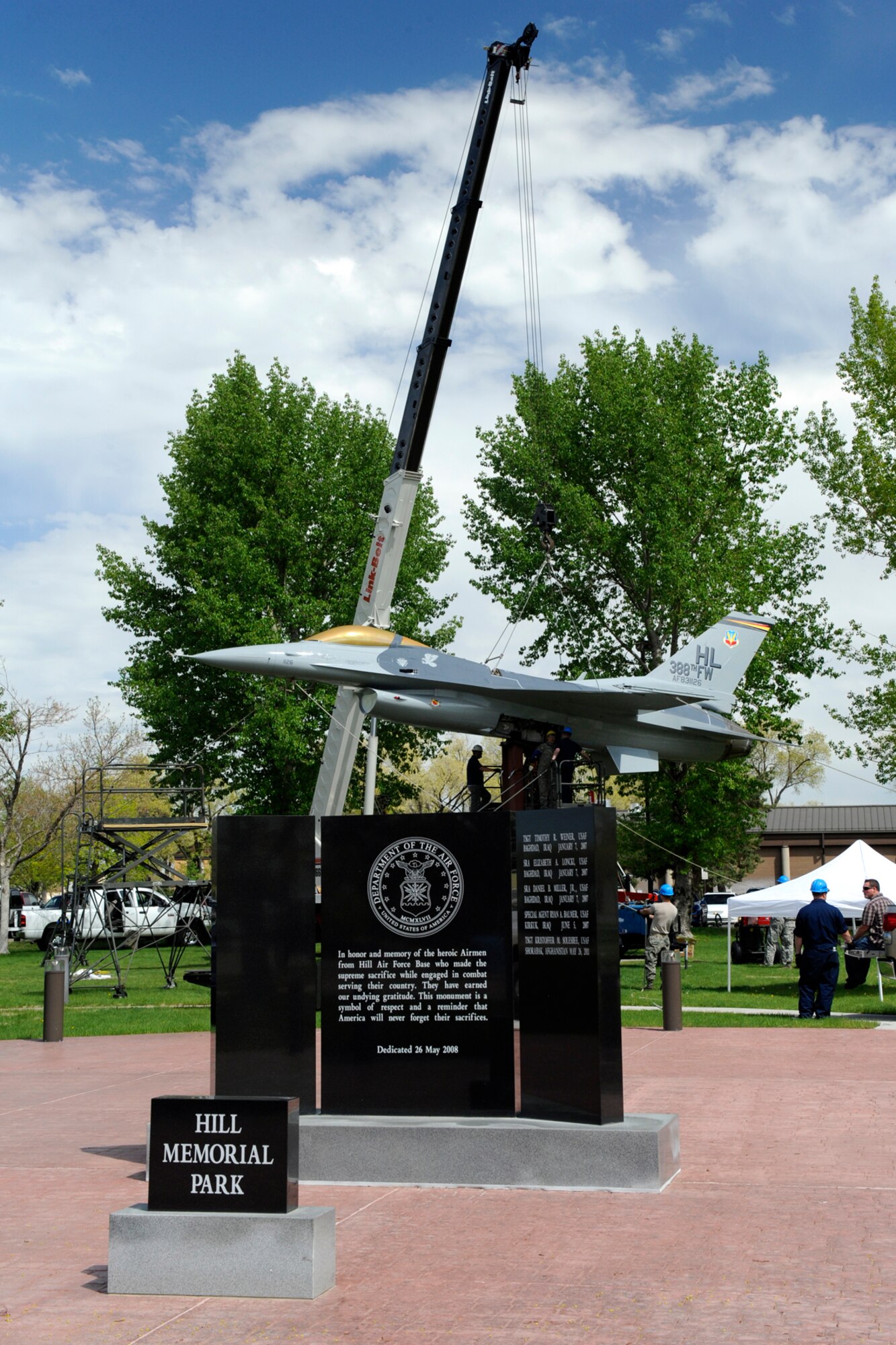 The 388th and 419th Fighter Wings and 75th Air Base Wing personnel converged efforts to place an F-16 Fighting Falcon static display at the Hill Memorial Park April 23. (U.S. Air Force photo by Todd Cromar/Released)