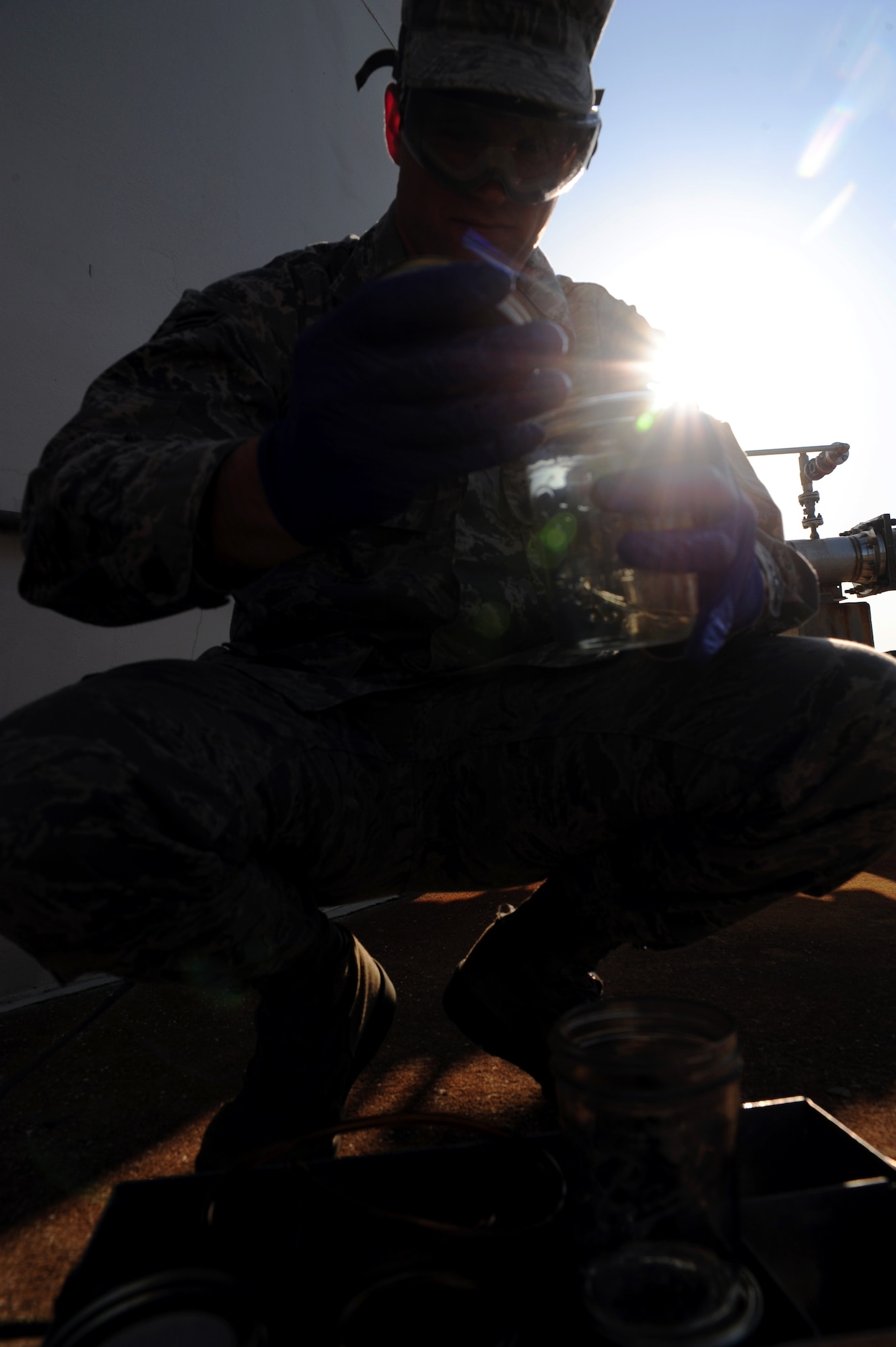 Airman 1st Class Mark Miller samples fuels at Joint Base Charleston –Air Base April 24. Fuel samples are tested for temperature and conductivity as well as the fuels’ systems icing inhibitor. (U.S. Air Force photo/Staff Sgt. Katie Gieratz) (Released)
