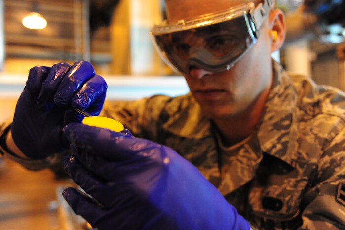Airman 1st Class Mark Miller tests fuels at Joint Base Charleston – Air Base April 24. Fuels are sampled and tested daily for water contamination. Miller is a 628 Logistics Readiness Squadron fuels laboratory. (U.S. Air Force photo/Staff Sgt. Katie Gieratz) (Released)