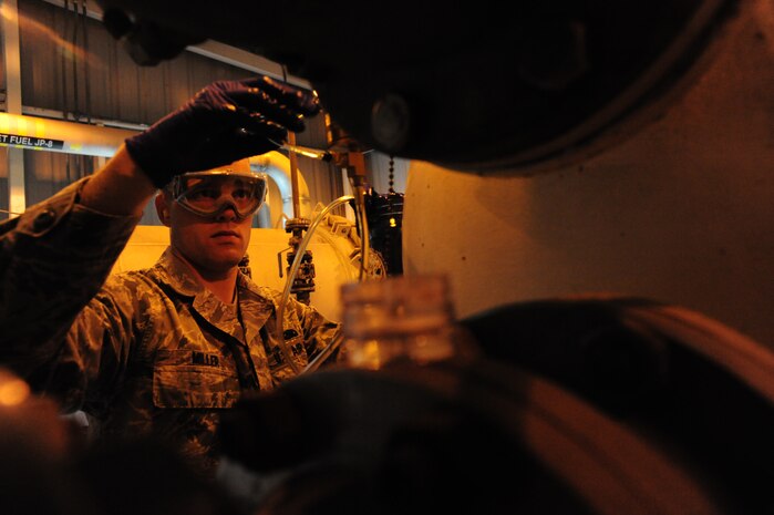 Airman 1st Class Mark Miller samples fuels at Joint Base Charleston – Air Base April 24. Fuels are sampled and tested daily. Miller is a 628 Logistics Readiness Squadron fuels laboratory. (U.S. Air Force photo/Staff Sgt. Katie Gieratz) (Released)