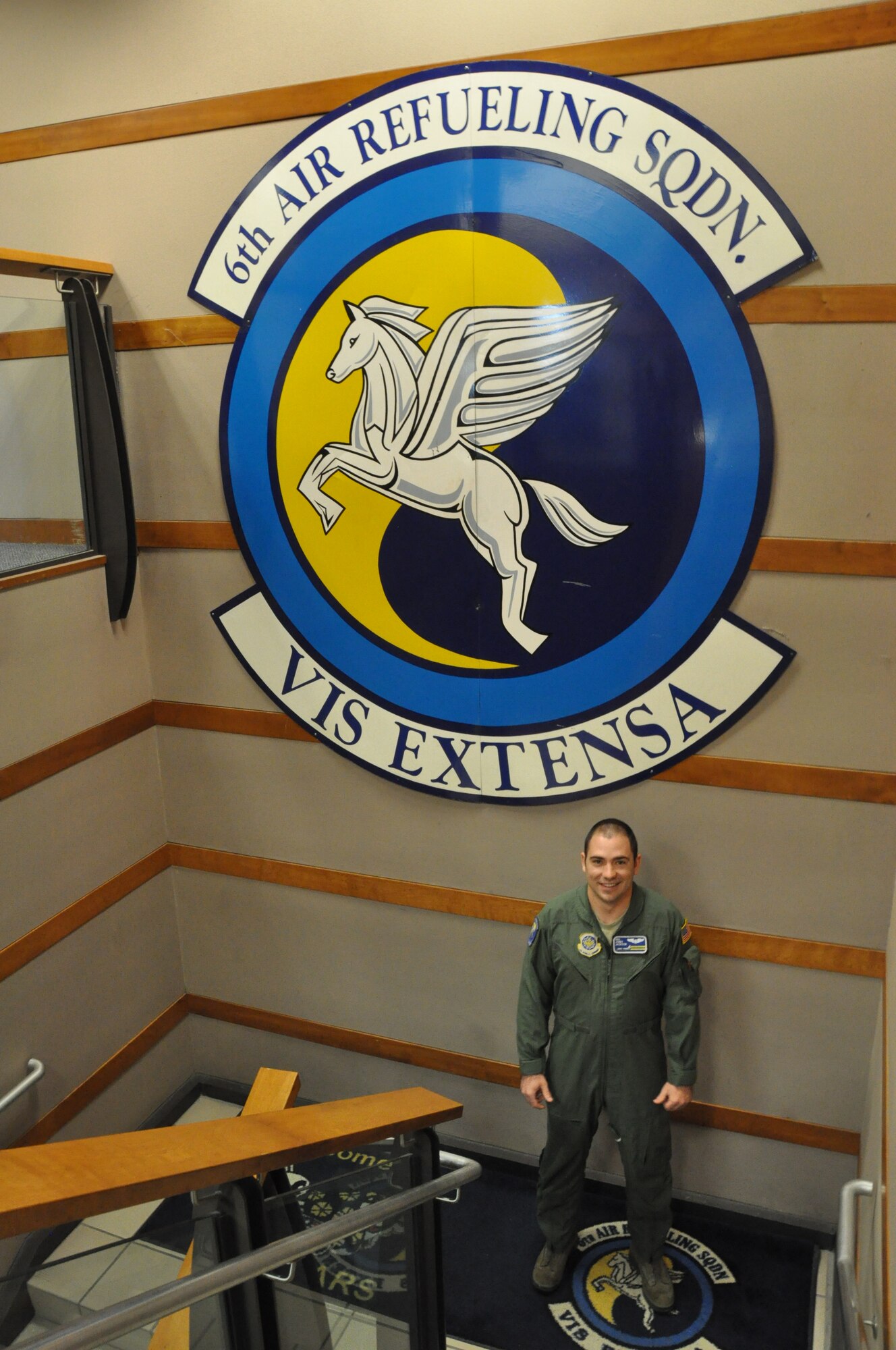 Senior Airman Jonathan Jackson poses in a stairwell beneath the 6th Air
Refueling Squadron logo. Jackson, 6th ARS KC-10 Extender boom operator, is a
nominee for the National Fatherhood Initiative's Military Fatherhood Award.
