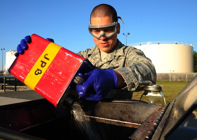 Staff Sgt. Jonathon Kloessel pours fuel into a collection bin after testing at Joint Base Charleston – Air Base April 24. Fuels for Air Force aircraft are sampled and tested daily. Kloessel is a 628th Logistics Readiness Squadron fuels laboratory technician.  (U.S. Air Force photo/Staff Sgt. Katie Gieratz)