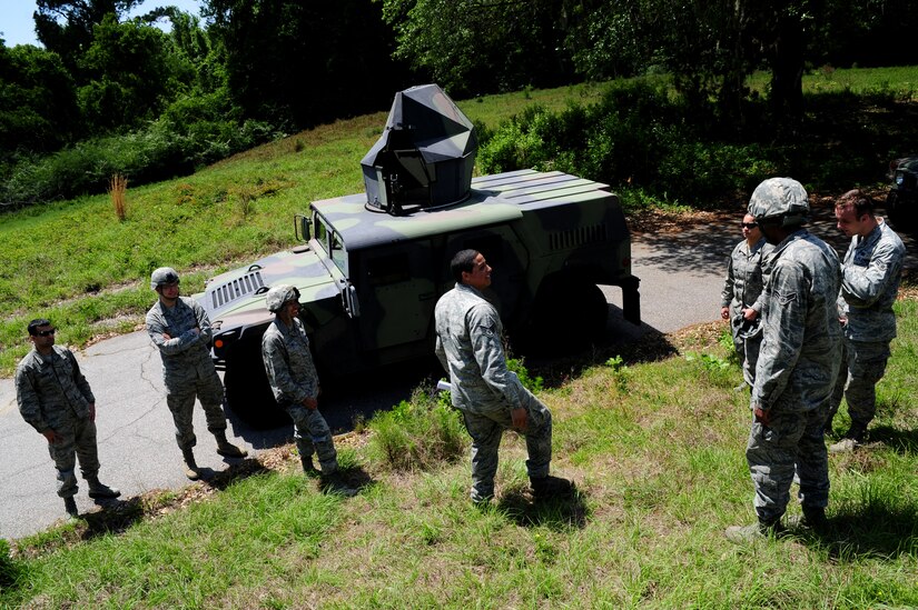 Staff Sgt. David Perez explains High-Mobility Multipurpose Wheeled Vehicle operations during tactical vehicle training at Joint Base Charleston - Air Base April 24. The monthly training is given to members of the 628th Security Forces Squadron to familiarize them with operating tactical vehicles and how to perform security checks while in a convoy. Perez is a trainer with the 628th SFS.   (U.S. Air Force photo/ Staff Sgt. Nicole Mickle)   