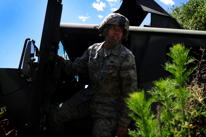 Airman 1st Class Angela Sell get out of the  High-Mobility Multipurpose Wheeled Vehicle during tactical vehicle training at Joint Base Charleston - Air Base April 24. The monthly training is given to members of the 628th Security Forces Squadron to familiarize them with operating tactical vehicles and how to perform security checks while in a convoy.  Sell is a 628th Security Forces Journeyman.    (U.S. Air Force photo/ Staff Sgt. Nicole Mickle)   