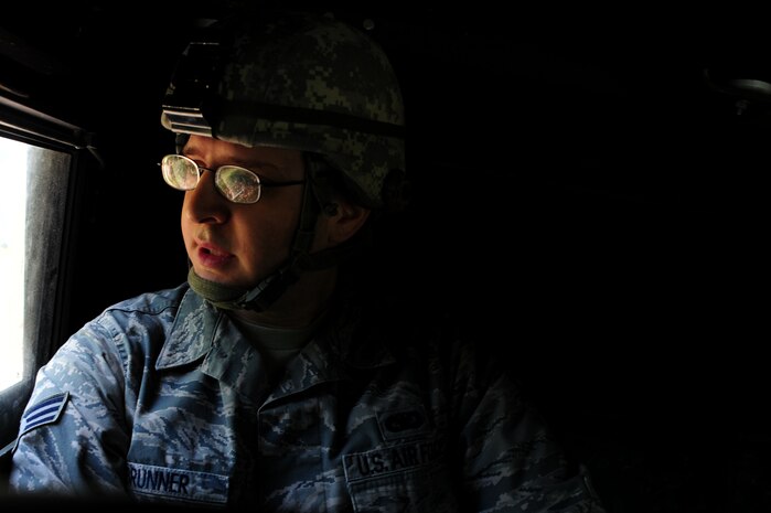 Senior Airman Anthony Brunner looks out the window while riding in a  High-Mobility Multipurpose Wheeled Vehicle during tactical vehicle training at Joint Base Charleston - Air Bas, April 24. The monthly training is given to members of the 628th Security Forces Squadron to familiarize them with operating tactical vehicles and how to perform security checks while in a convey. Brunner is a 628th Security Forces journeyman.    (U.S. Air Force photo/ Staff Sgt. Nicole Mickle) 