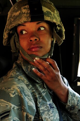 Airman 1st Class Angela Sell adjusts her helmet prior to driving a High-Mobility Multipurpose Wheeled Vehicle during tactical vehicle training at Joint Base Charleston - Air Base April 24. The monthly training is given to members of the 628th Security Forces Squadron to familiarize them with operating tactical vehicles and how to perform security checks while in a convoy. Sell is a 628th SFS journeyman.   (U.S. Air Force photo/ Staff Sgt. Nicole Mickle)   
