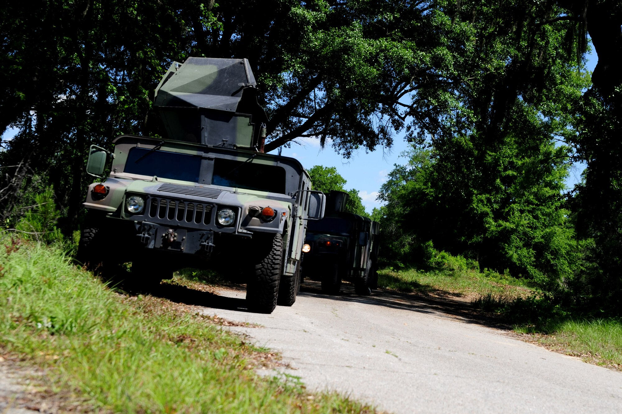 Security Forces members drive High-Mobility Multipurpose Wheeled Vehicles during tactical vehicle training at Joint Base Charleston - Air Base, April 24. The monthly training is given to members of the 628th SFS to familiarize them with operating tactical vehicles and how to perform security checks while in a convoy.    (U.S. Air Force photo/ Staff Sgt. Nicole Mickle)   