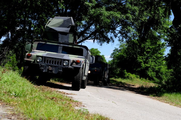 Security Forces members drive High-Mobility Multipurpose Wheeled Vehicles during tactical vehicle training at Joint Base Charleston - Air Base, April 24. The monthly training is given to members of the 628th SFS to familiarize them with operating tactical vehicles and how to perform security checks while in a convoy.    (U.S. Air Force photo/ Staff Sgt. Nicole Mickle)   