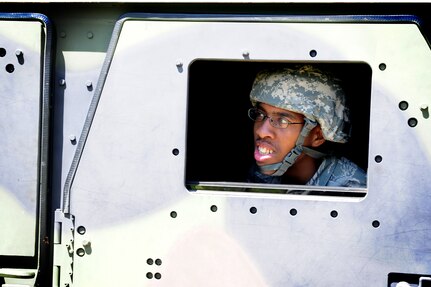Airman 1st Class Donta Mitchell looks out of a High-Mobility Multipurpose Wheeled Vehicle during tactical vehicle training at Joint Base Charleston - Air Base April 24. The monthly training is given to members of the 628th Security Forces Squadron to familiarize them with operating tactical vehicles and how to perform security checks while in a convoy.  Mitchell is a Security Forces Journeyman.  (U.S. Air Force photo/ Staff Sgt. Nicole Mickle)   