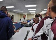 Master Sgt. Donald Stephany, 919th Operations Support Squadron, displays a parachute for Junior ROTC cadets touring the unit’s life support equipment section at Duke Field, Fla., April 24, 2012.   The wing invited senior cadets from five area high schools to tour the base and receive a flight to help them explore Air Force careers through direct interaction with Duke Field’s Citizen Commandos. (U.S. Air Force photo/Tech. Sgt. Jasmin Taylor)
