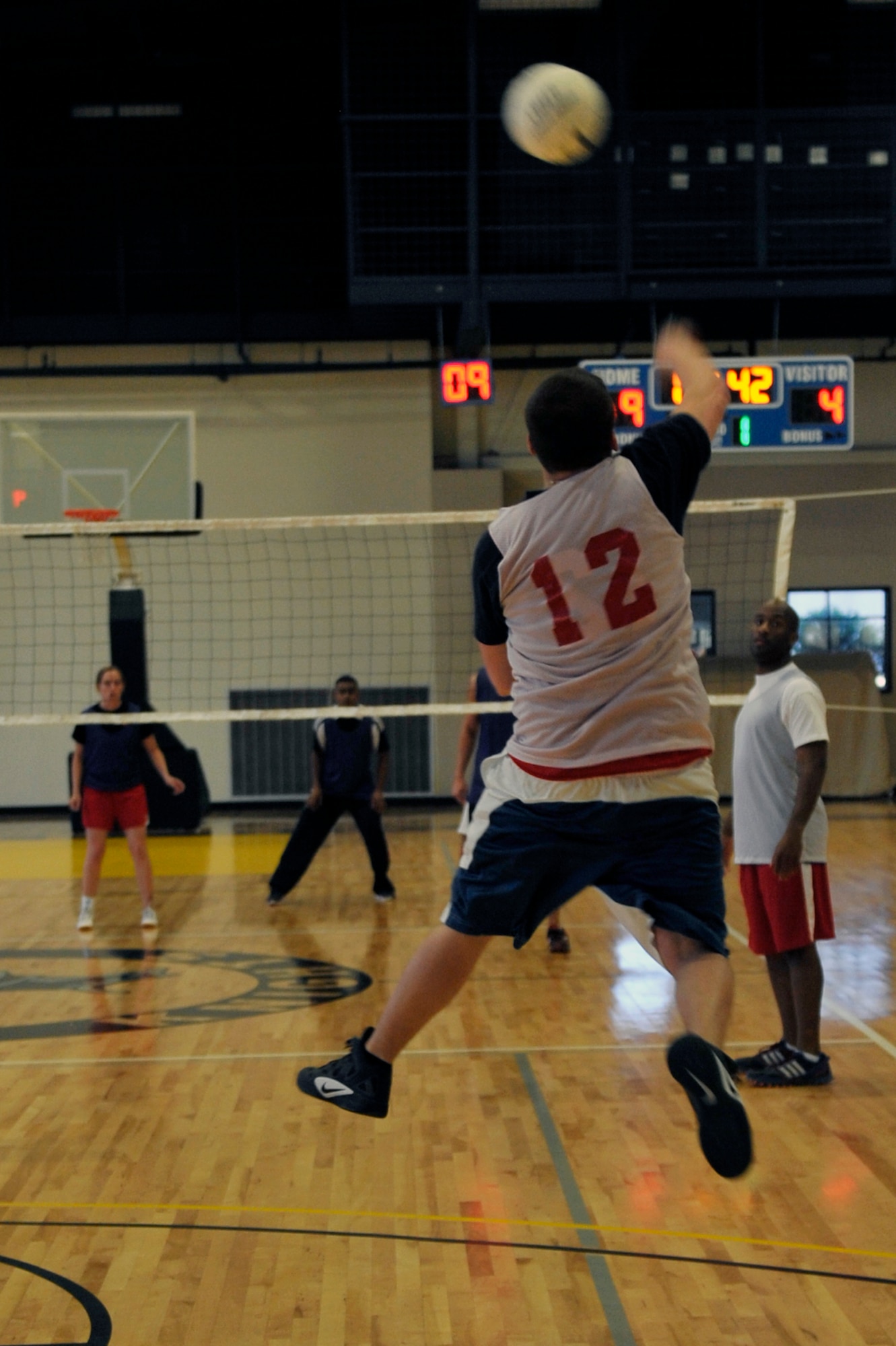 Jared Henley, spiker for the 19th Force Support Squadron, serves the ball during an intramural volleyball game between the 19th FSS and the 19th Medical Group, April 24, 2012, at Little Rock Air Force Base, Ark. The 19th FSS won both games  the 19th 25-15 and 25-16. (U.S. Air Force photo by Airman 1st Class Rusty Frank)