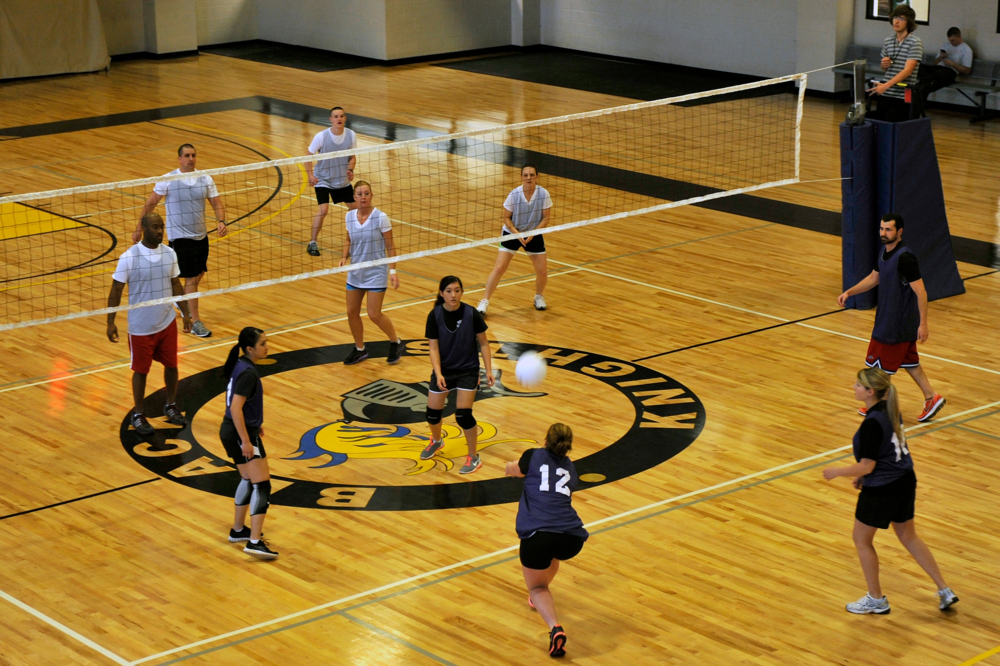 The 19th Force Support Squadron and the 19th Medical Group square off during the an intramural volleyball game, April 24, 2012, at Little Rock Air Force Base, Ark. The 19th FSS won both games 25-15 and 25-16 . (U.S. Air Force photo by Airman 1st Class Rusty Frank)