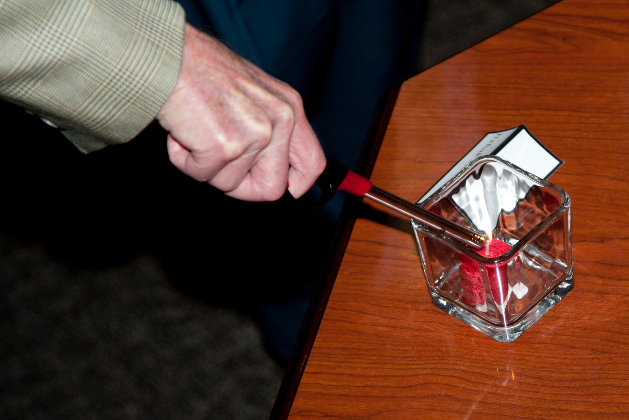 HOLLOMAN AIR FORCE BASE, N.M. – A candle is lit during a naming and candle lighting ceremony at the Community Activity Center April 19. The ceremony was held during the nation’s annual “Days of Remembrance,” which honors victims of the Holocaust. (U.S. Air Force photo by Airman 1st Class Anthony M. Ward / Released)