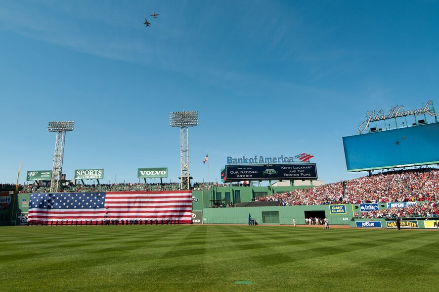 BOSTON – An F-16 and P-51 fly over Fenway Park during the playing of the national anthem April 20. The flyover, featuring modern and World War II-era aircraft, was part of the 100th anniversary of Fenway Park celebration. (U.S. Air Force photo by Rick Berry)