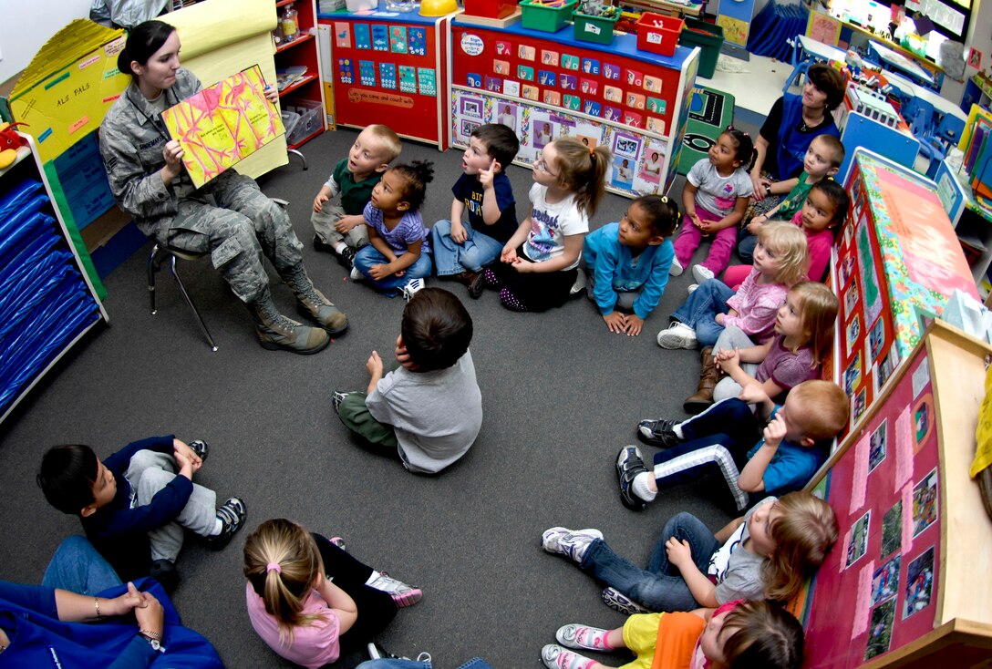 U.S. Air Force Senior Airman Sarah Shoemaker, 633rd Medical Operations Squadron mental health technician, reads to children at the Langley Air Force Base, Va., child development center, April 25, 2012. Shoemaker was one of three volunteers who read to the children as part of “Read to Kids Day,” sponsored by the Langley Family Advocacy office. (U.S. Air Force photo by Senior Airman Wesley Farnsworth)