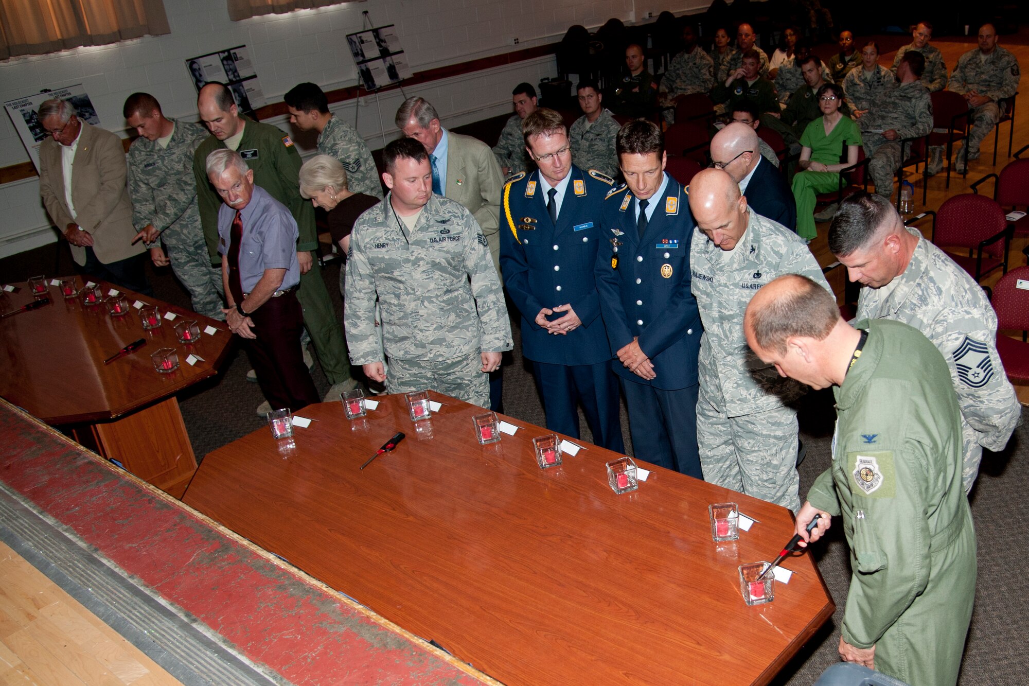 HOLLOMAN AIR FORCE BASE, N. M. – Col. Kenneth Johnson, 49th Wing vice commander, lights the first candle along with other members of Team Holloman during a naming and candle lighting ceremony at the Community Activity Center April 19. The ceremony was held during the nation’s annual “Days of Remembrance,” which honors victims of the Holocaust. (U.S. Air Force photo by Airman 1st Class Anthony M. Ward / Released)