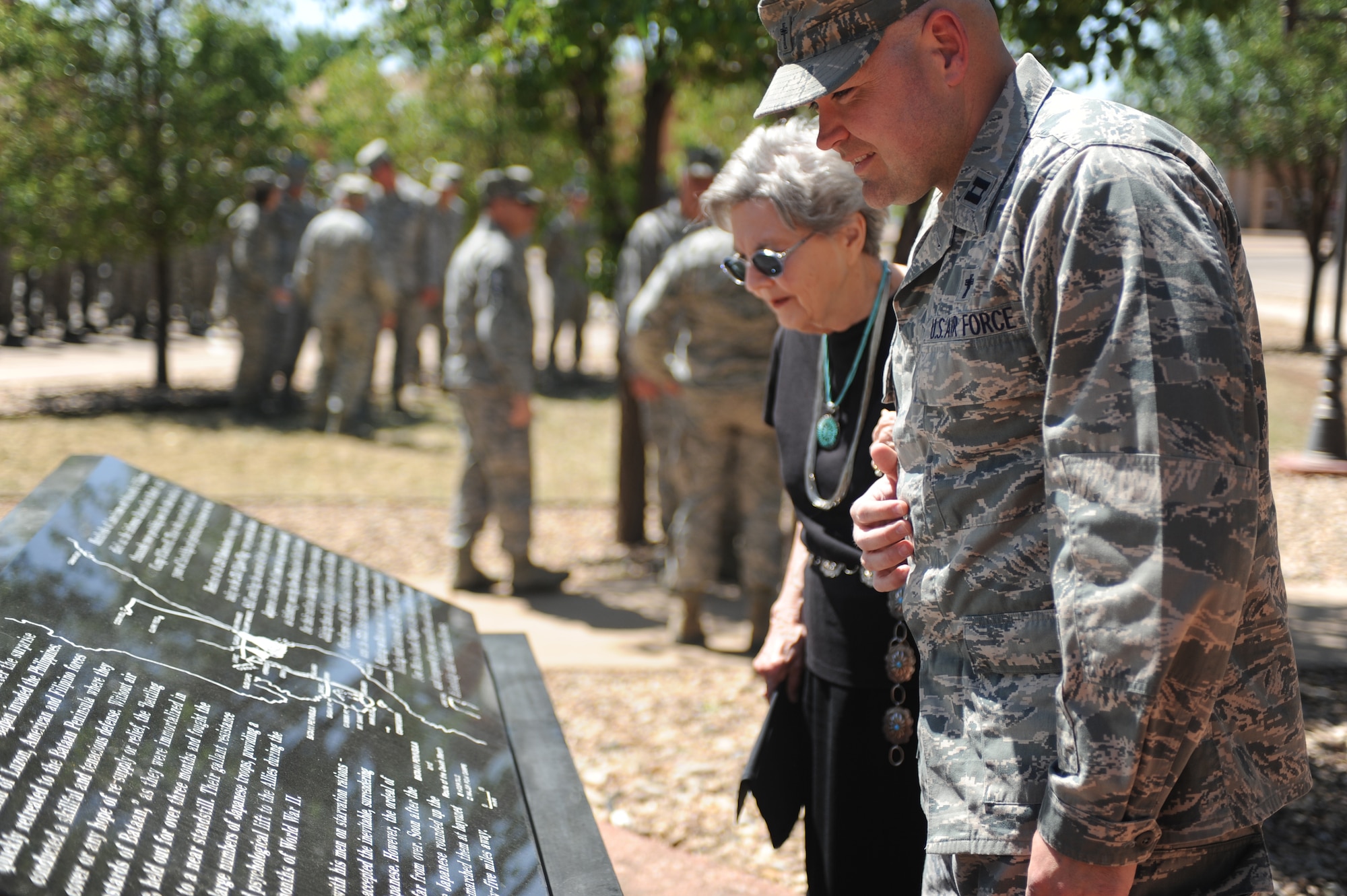 U.S. Air Force Capt. Joshua Payne and Dorthy Cave admire the POW/ Bataan Death March memorial at Cannon Air Force Base, N.M., April 24, 2012. The Cannon Air Force Base chapel arranged a remembrance ceremony for the 70th anniversary of the Bataan Death March. (U.S. Air Force photo by Airman 1st Class Eboni Reece)