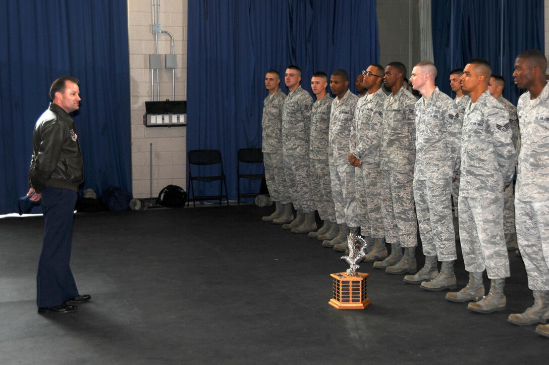 11th Wing Commander Col. Kenneth R. Rizer congratulated the U.S. Air Force Honor Guard Drill Team for winning the Joint Service Drill Exhibition on April 14 at the Jefferson Memorial in Washington, D.C. Drill teams from all four branches of the American armed services competed at the event. (U.S. Navy photo by Paul Bello)